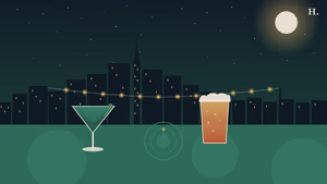 Martini glass and pint glass against a Houston night skyline with string lights, bars museum district