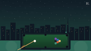 Pool halls Houston: billiard balls racked on green felt under the Houston night skyline