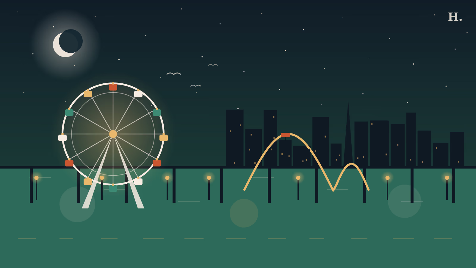 Galveston pleasure pier at night: Ferris wheel and Iron Shark roller coaster over the Gulf of Mexico